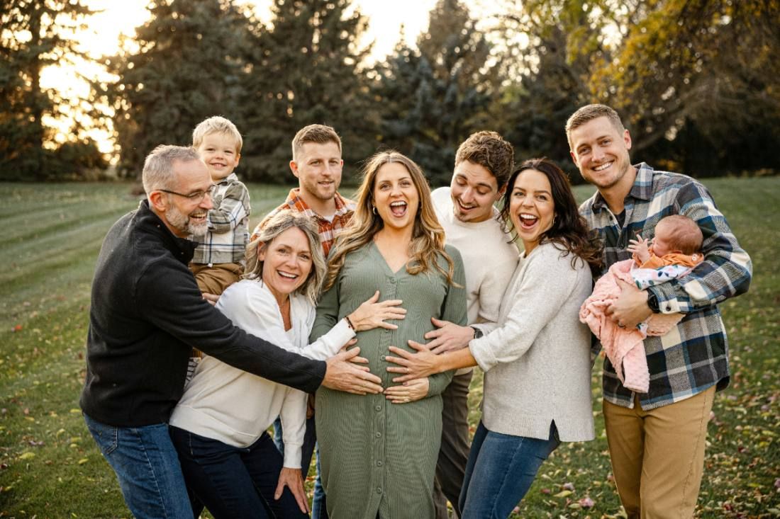 A large family gathered together outdoors