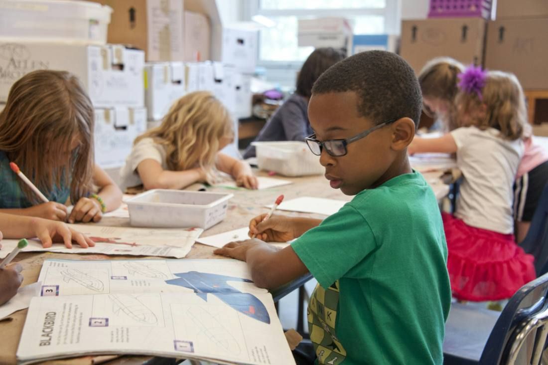 Children at their desks in a classroom